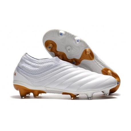 white and gold adidas soccer cleats